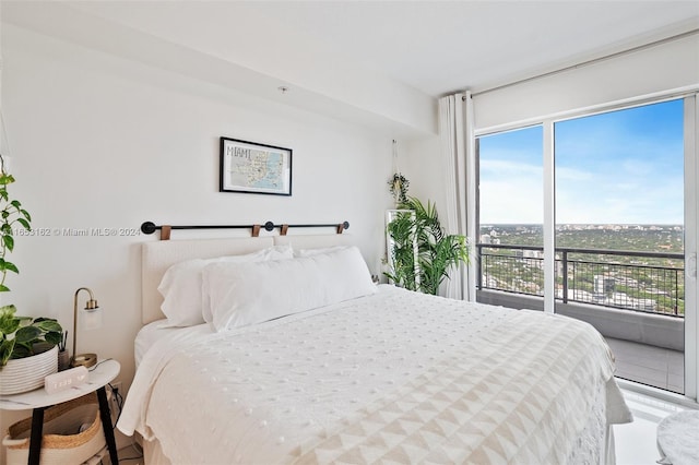 bedroom with multiple windows and access to outside