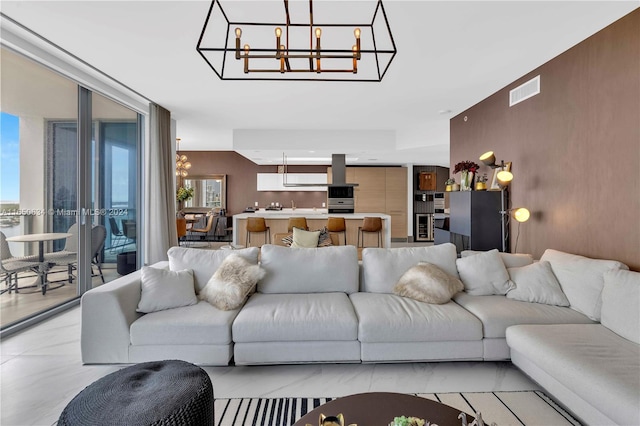 living room with an inviting chandelier