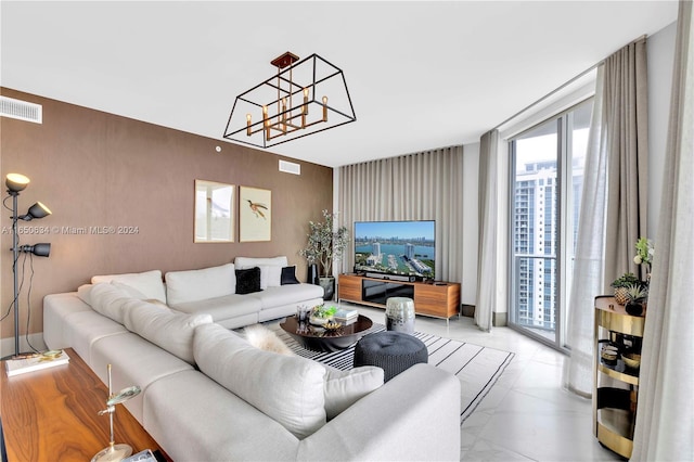 living room featuring a notable chandelier