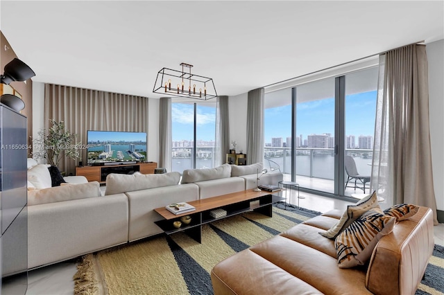 living room with floor to ceiling windows and an inviting chandelier