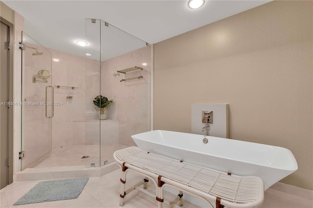 bathroom with shower with separate bathtub