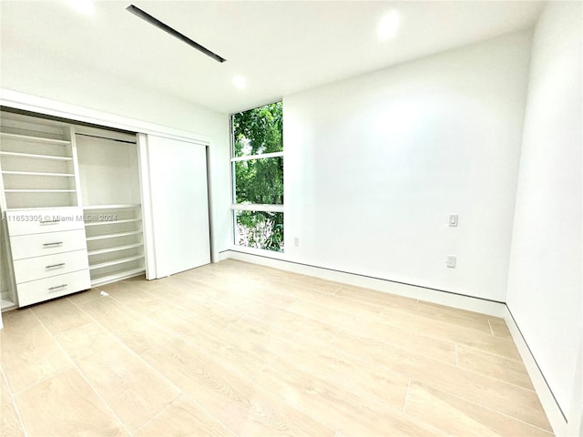 unfurnished bedroom with light hardwood / wood-style floors