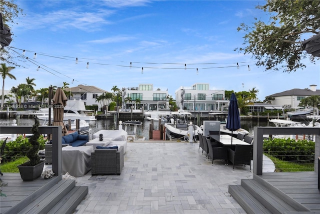 exterior space featuring a water view and an outdoor living space