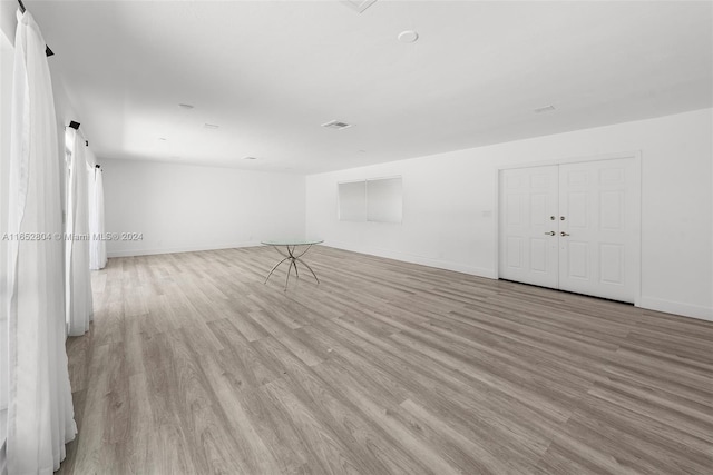 spare room with light hardwood / wood-style flooring