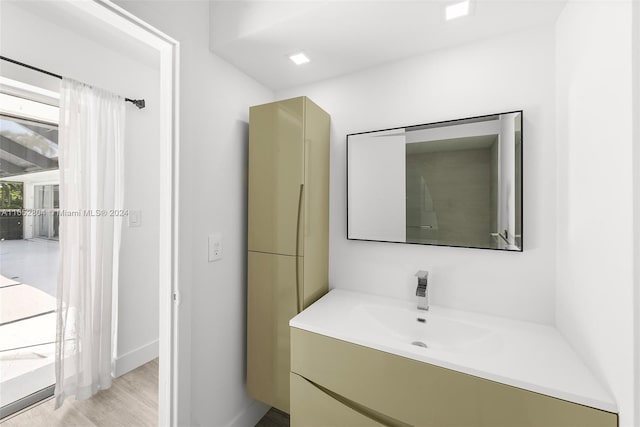 bathroom with vanity and hardwood / wood-style floors