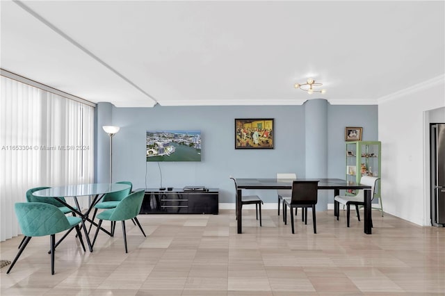 dining space with ornamental molding