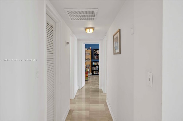 hallway with light tile patterned floors