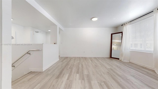 spare room with light hardwood / wood-style flooring