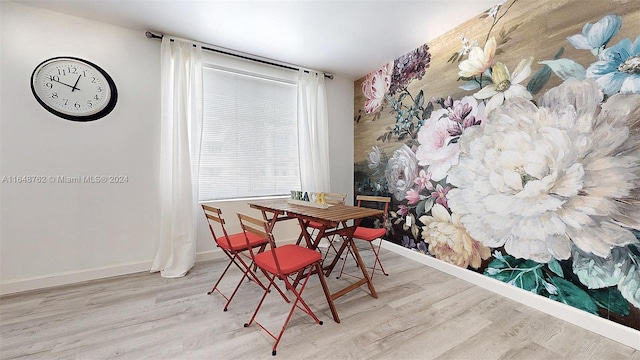 dining area with hardwood / wood-style flooring