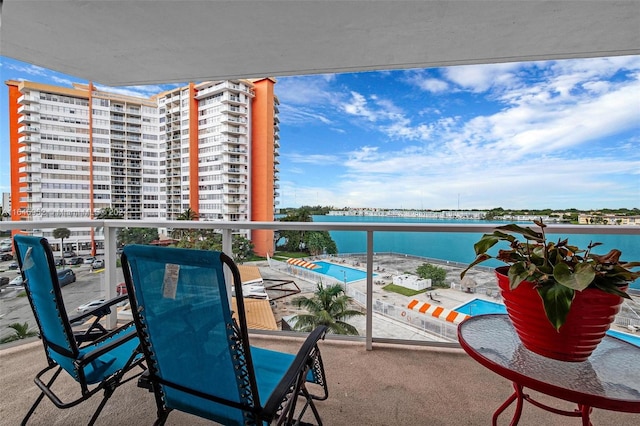 balcony featuring a water view