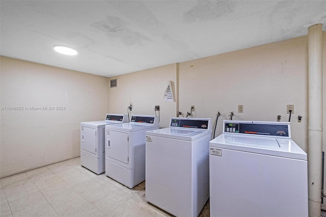 washroom with washer and dryer