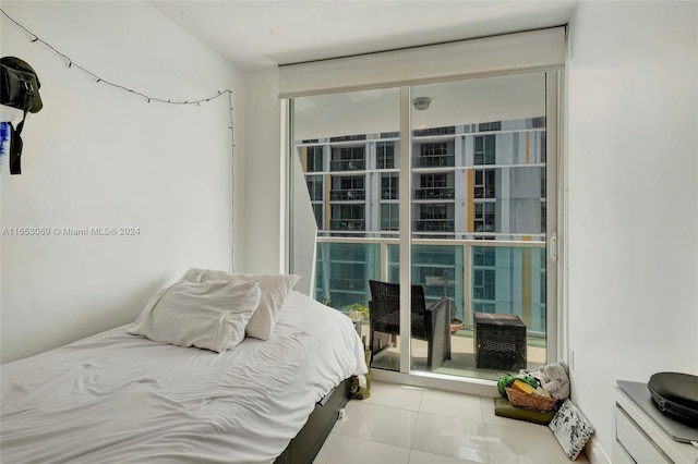 bedroom with light tile patterned floors