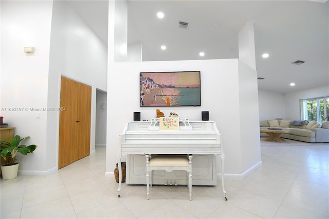 hall featuring light tile patterned floors