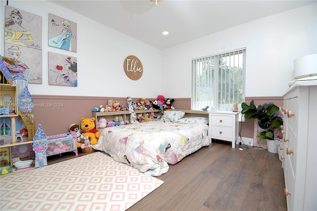 bedroom with dark hardwood / wood-style flooring