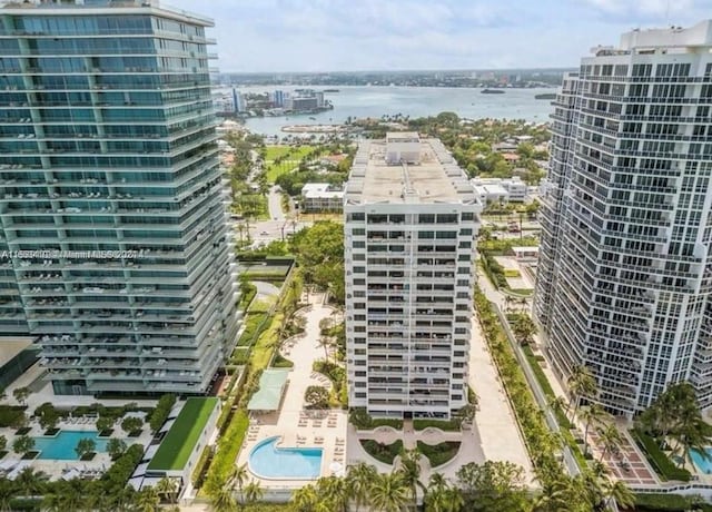 birds eye view of property with a water view