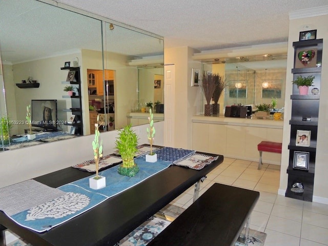 dining area featuring ornamental molding, a textured ceiling, and light tile patterned flooring