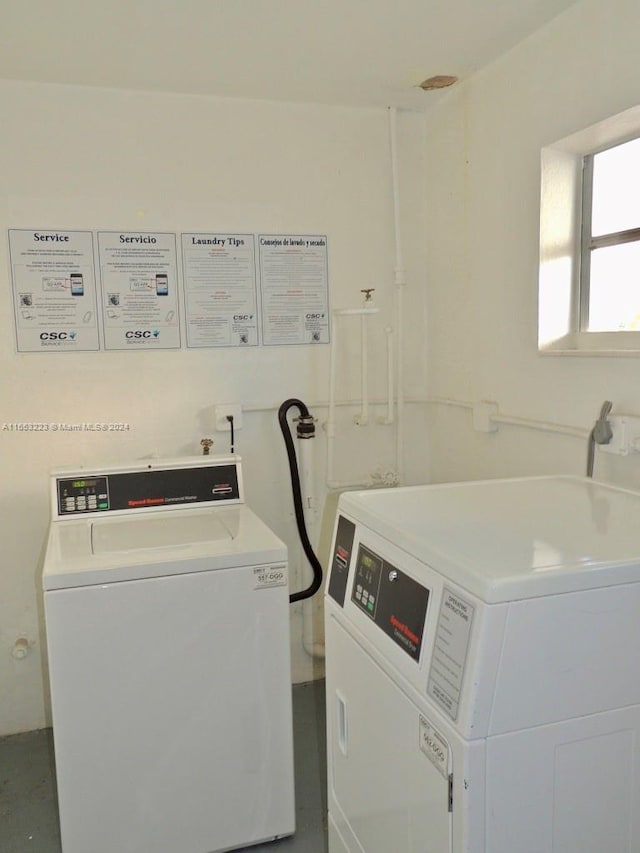 laundry area featuring washing machine and clothes dryer