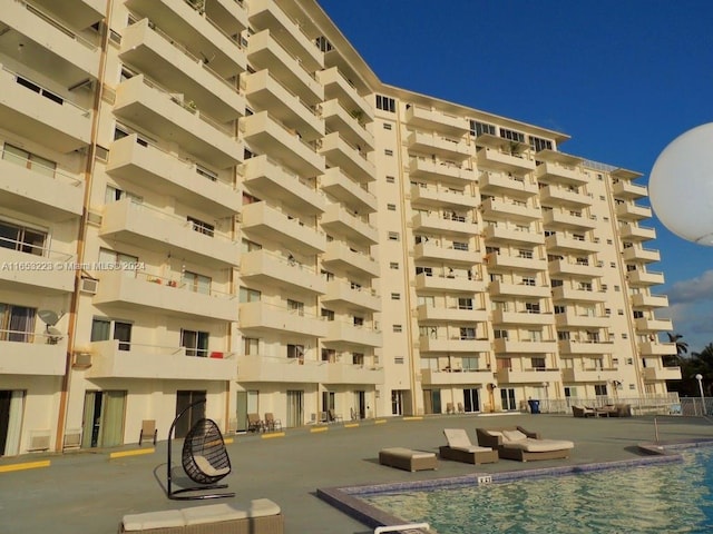 view of property featuring a community pool