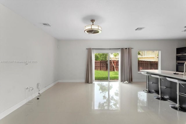 empty room with light tile patterned flooring