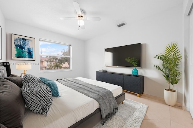 bedroom featuring ceiling fan and light tile patterned floors