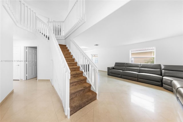 stairway with tile patterned floors