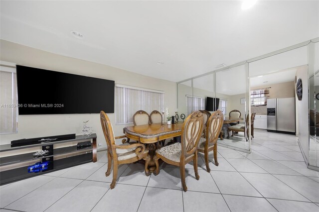 dining area featuring light tile patterned floors