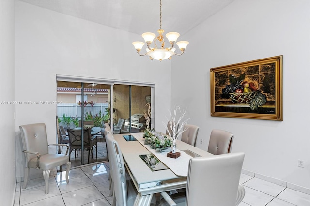 dining space with light tile patterned floors and an inviting chandelier