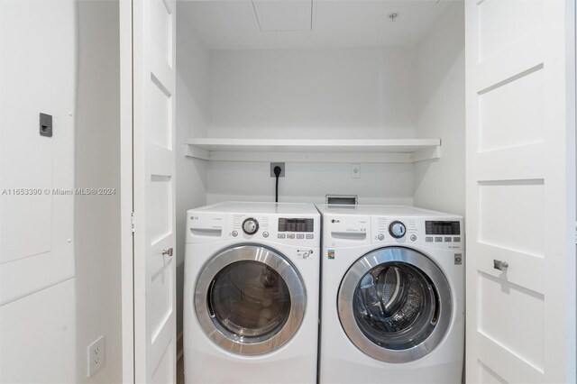 laundry room featuring washing machine and dryer