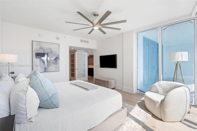 bedroom featuring light wood-type flooring and ceiling fan