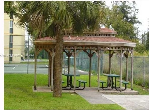 view of property's community with a yard and a gazebo