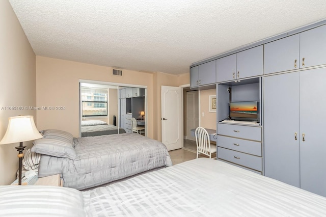 bedroom featuring a textured ceiling