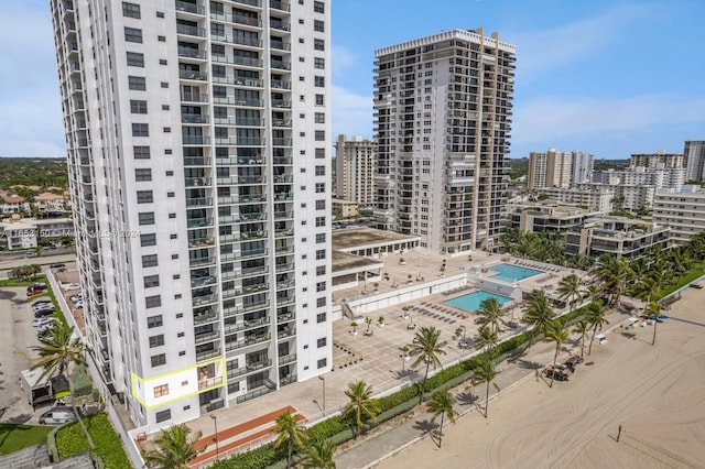 view of building exterior with a community pool