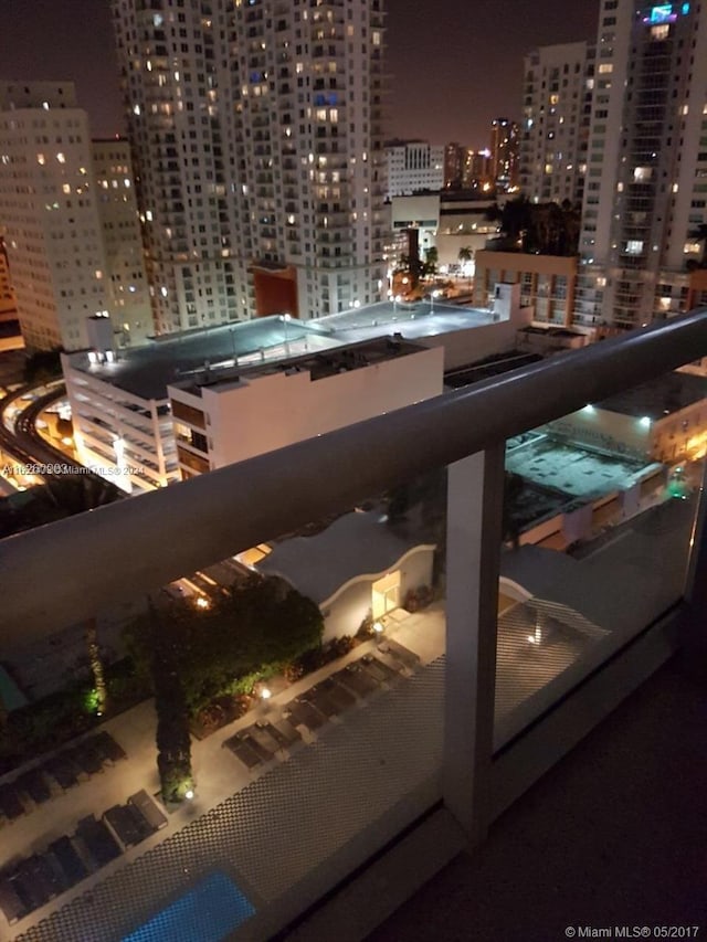 view of balcony at twilight