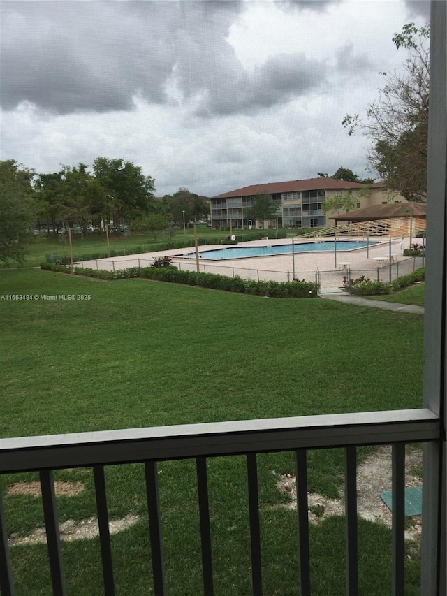 view of yard featuring a community pool