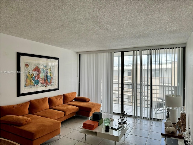 tiled living room with a wall of windows and a textured ceiling