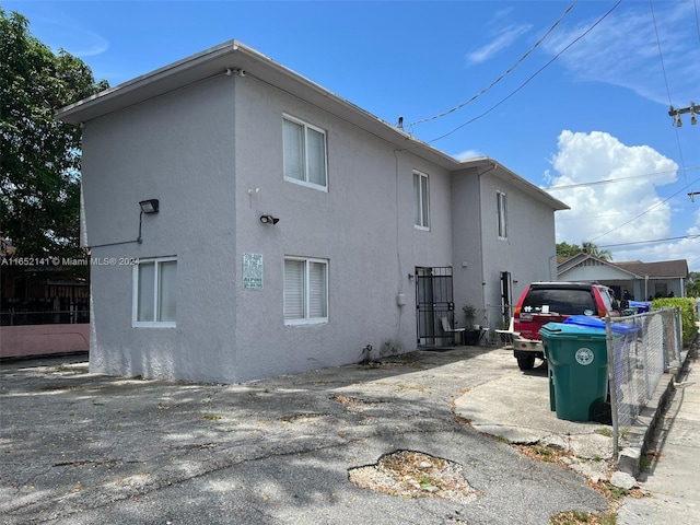 rear view of property with a garage