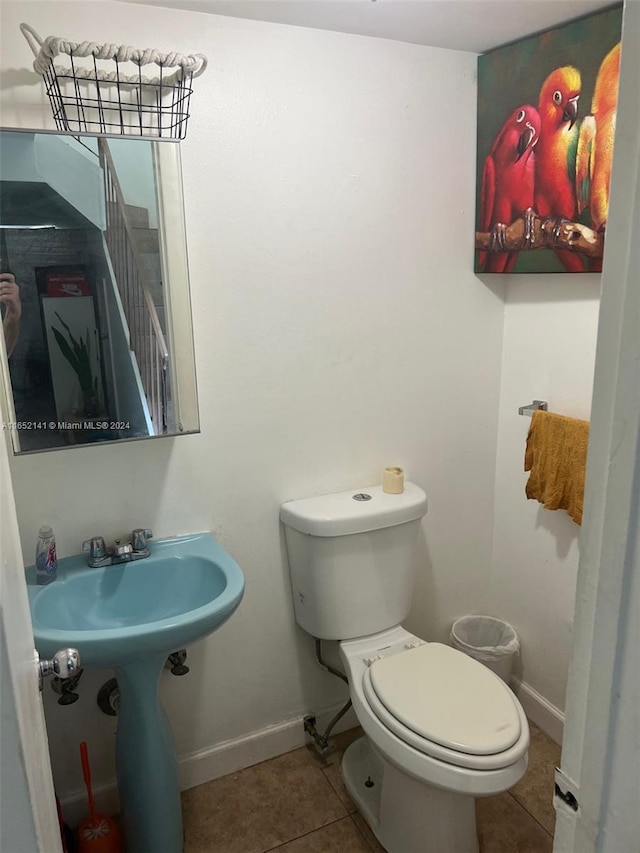 bathroom featuring tile patterned flooring and toilet