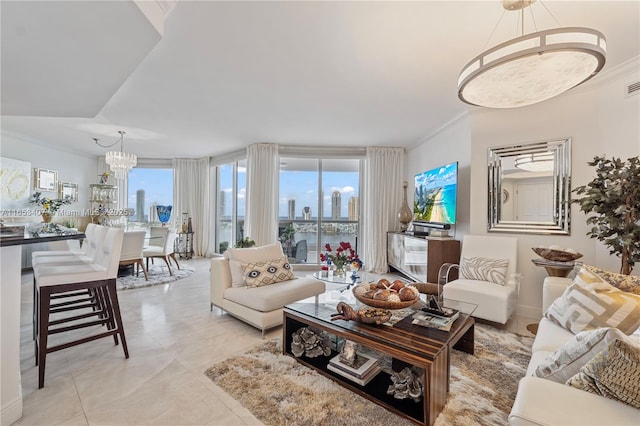 living room with a notable chandelier and ornamental molding