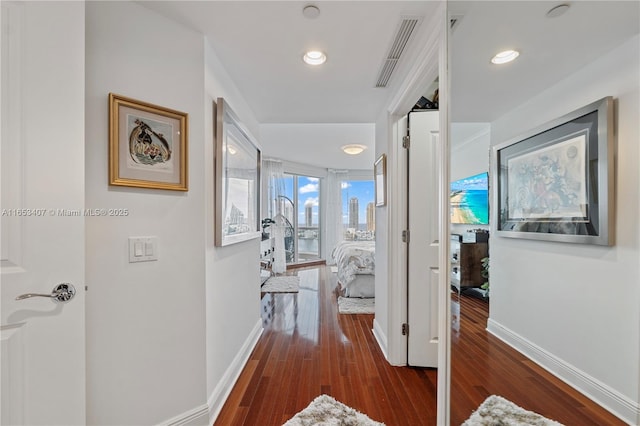 corridor with dark hardwood / wood-style floors