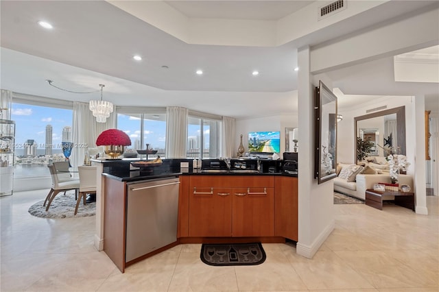 kitchen with dishwasher, hanging light fixtures, a notable chandelier, kitchen peninsula, and a raised ceiling