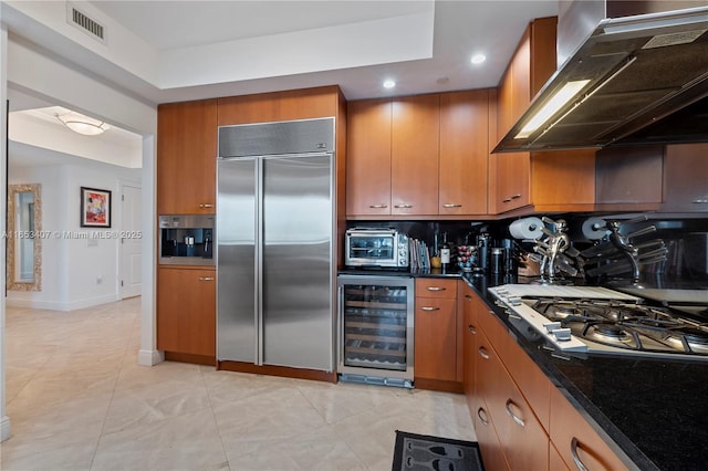 kitchen with wine cooler, island range hood, tasteful backsplash, and stainless steel appliances