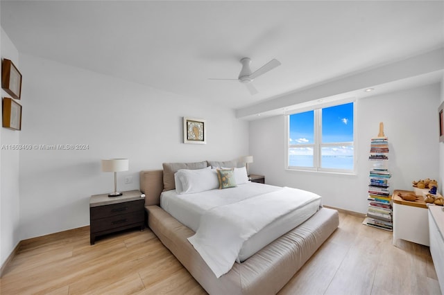 bedroom featuring light hardwood / wood-style flooring and ceiling fan