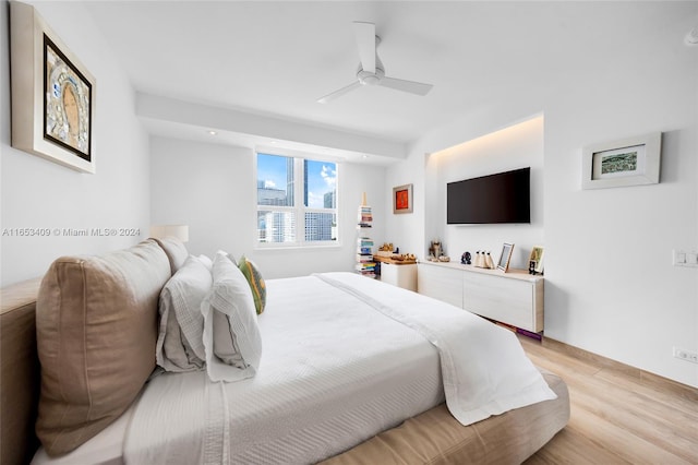 bedroom featuring ceiling fan and light hardwood / wood-style flooring