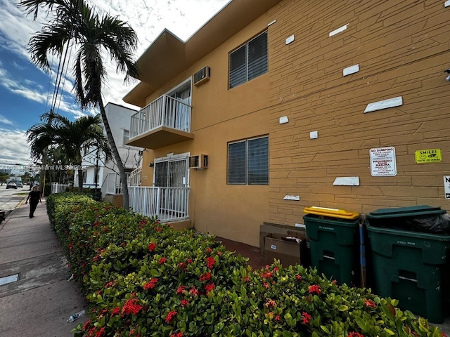 exterior space featuring a wall unit AC