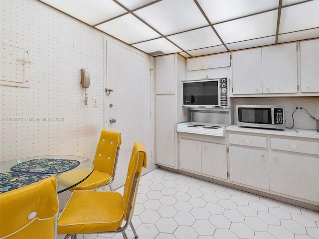 kitchen featuring a drop ceiling