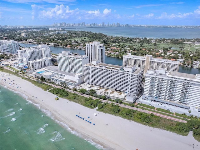 birds eye view of property with a view of the beach and a water view