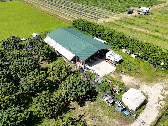 birds eye view of property with a rural view