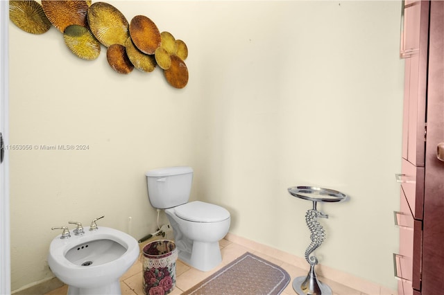 bathroom featuring a bidet, toilet, and tile patterned floors