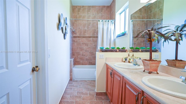 bathroom featuring shower / tub combo and vanity