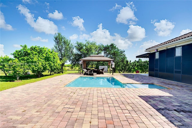 view of pool with a patio area and a gazebo